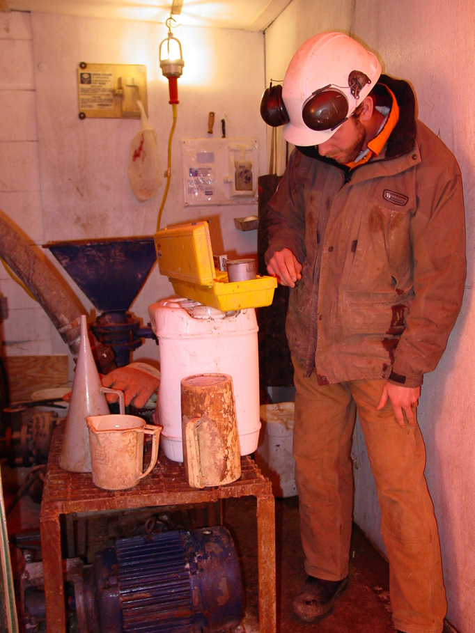 Geoscientist taking measurements of fluids to test soil samples